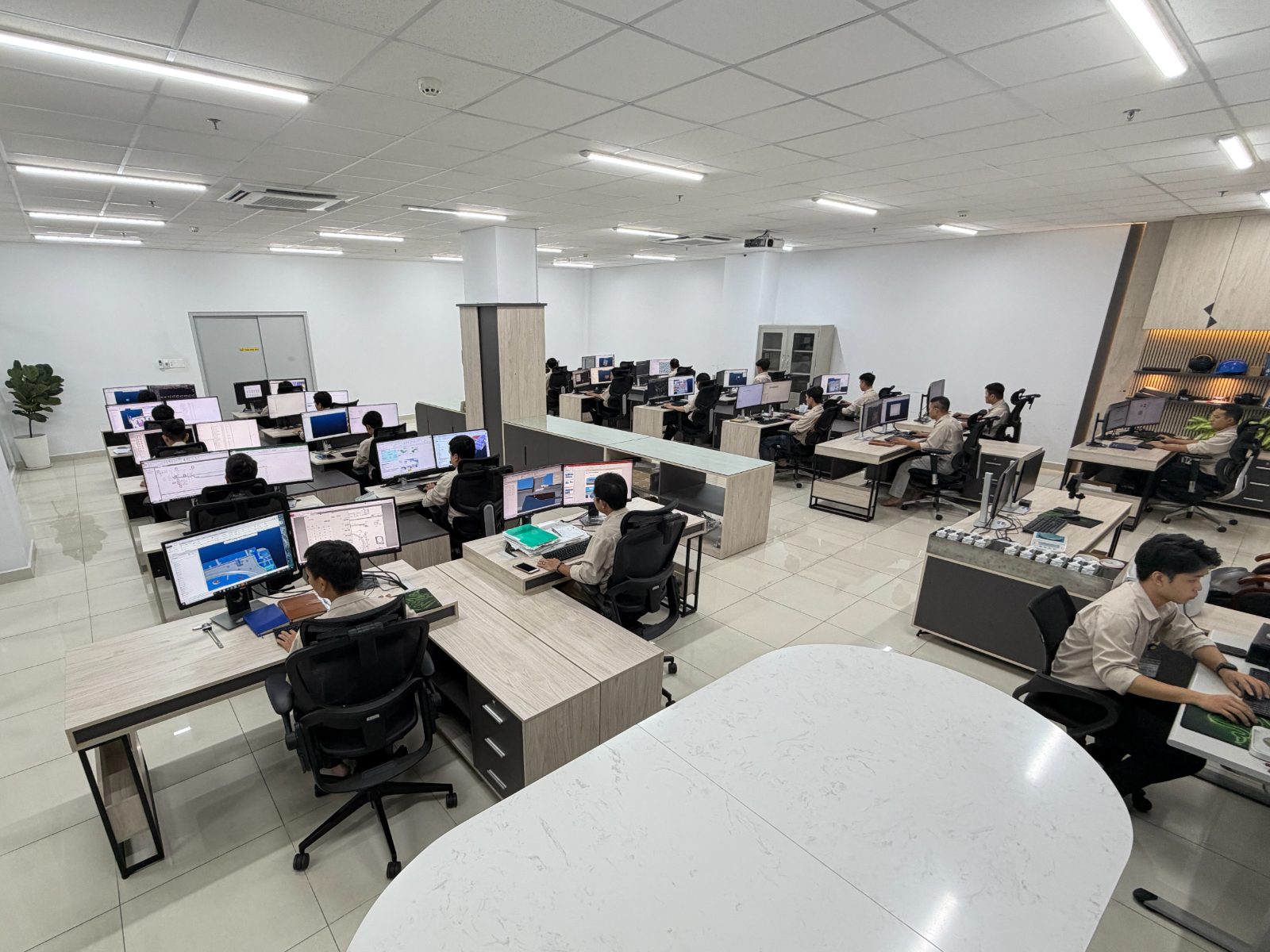 Lap Phuc design office &mdash; engineers at multi-monitor CAD workstations